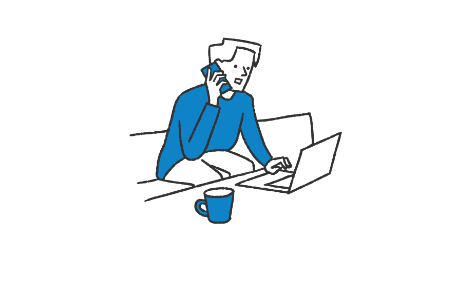 パソコンの前で電話をかける男性のイラスト